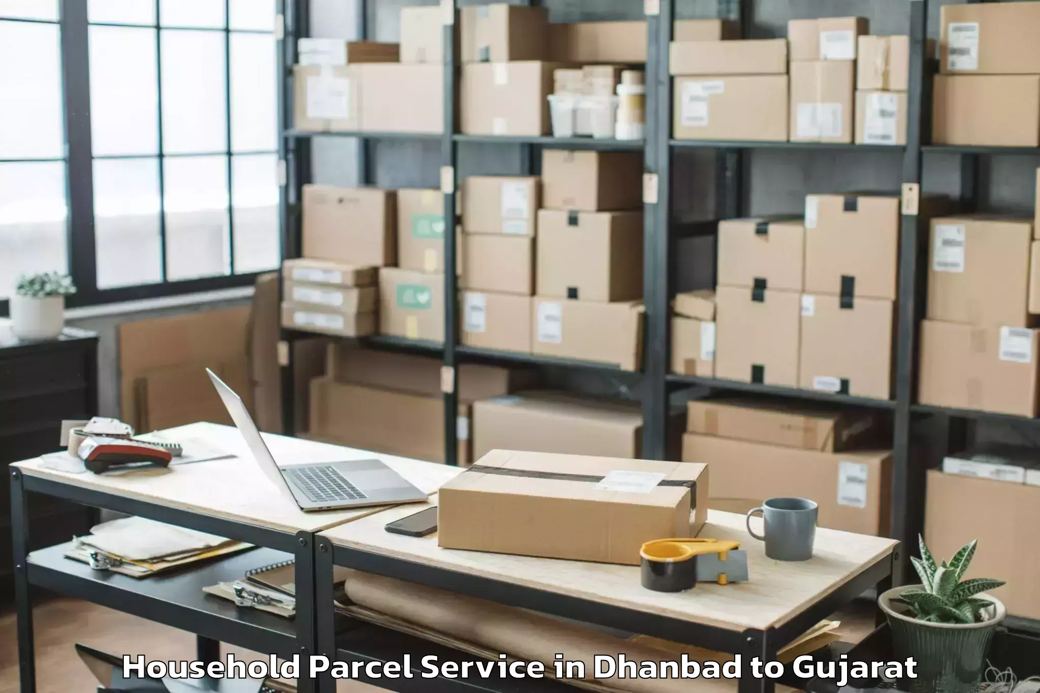 Easy Dhanbad to Anjar Household Parcel Booking